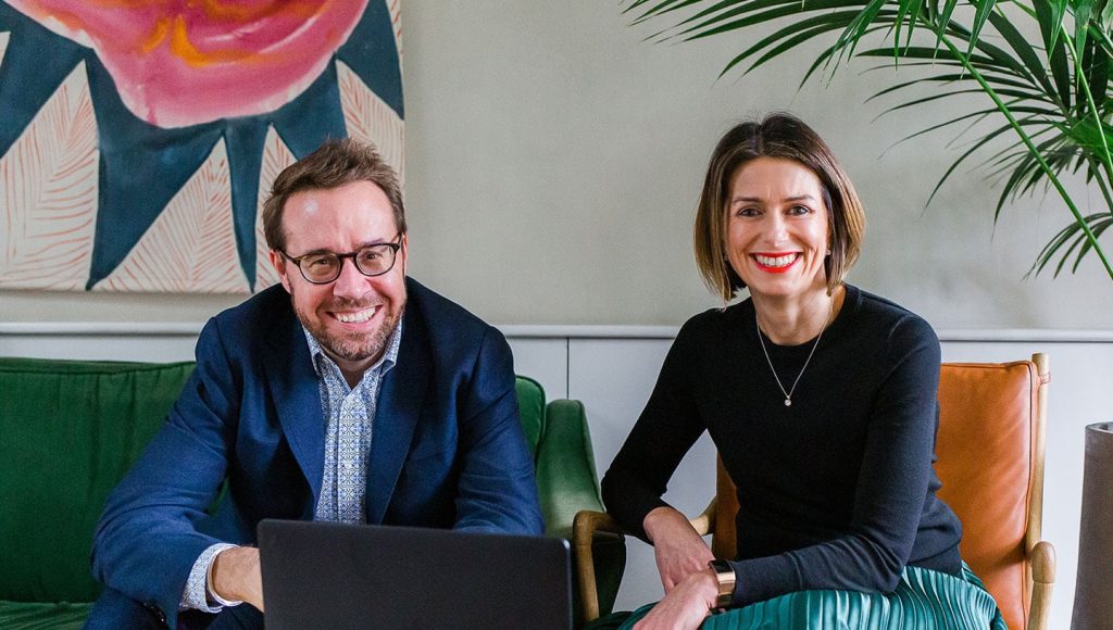 Alex and Chris sat with a laptop